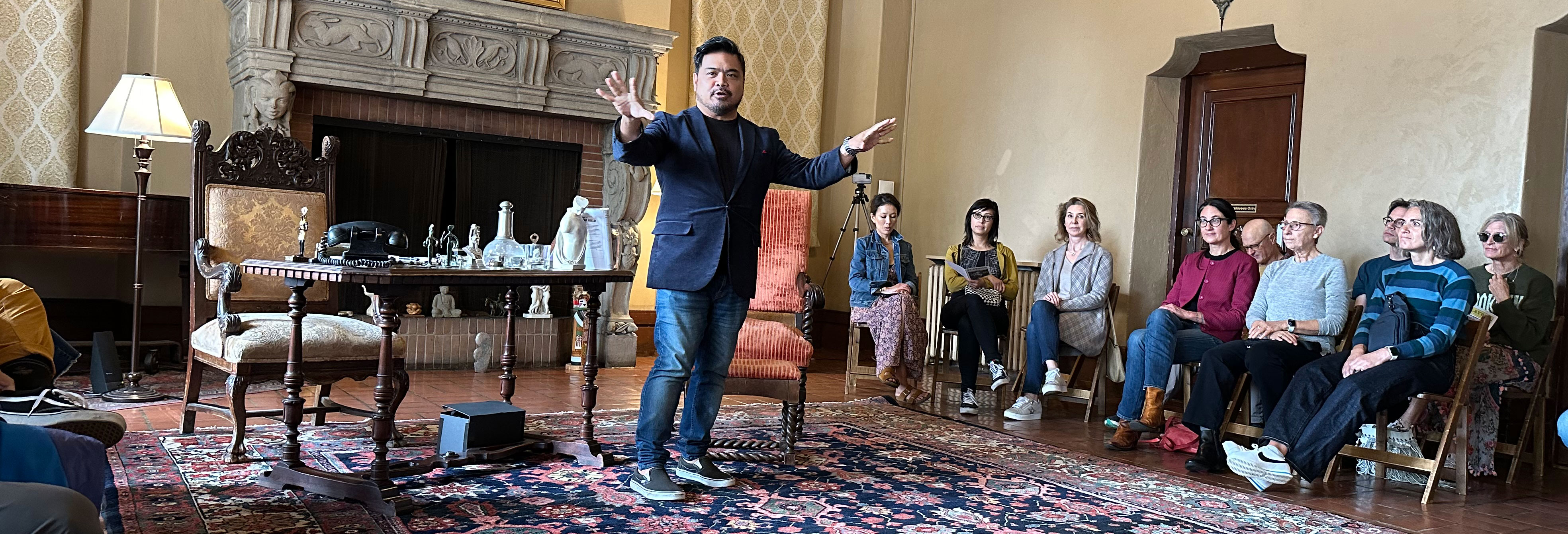 Artistic Director Enrico Banson welcoming audiences to 'Freud's Last Session.''